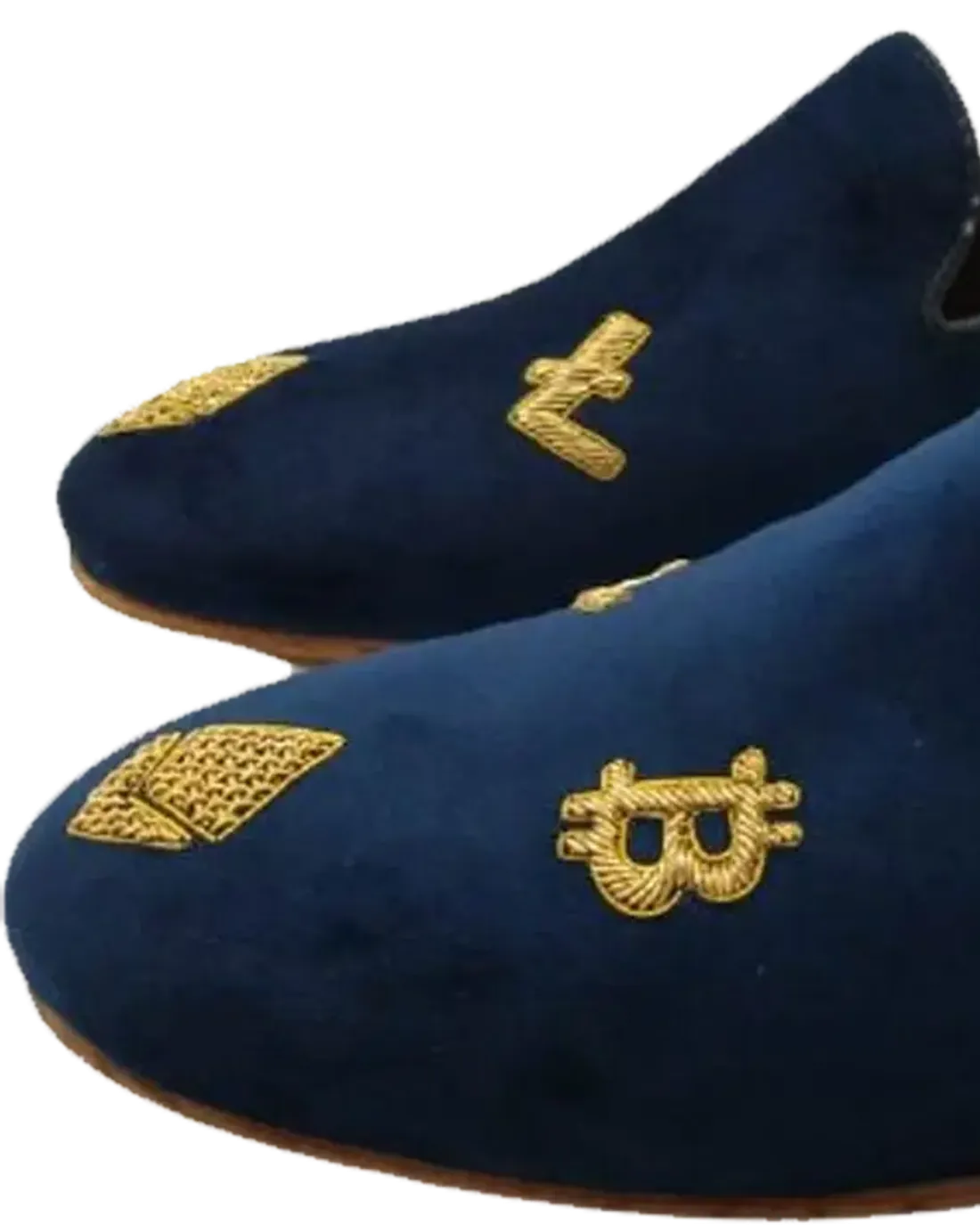 Flat-lay of AARVIKA's first collection — velvet juttis with gold embroidery