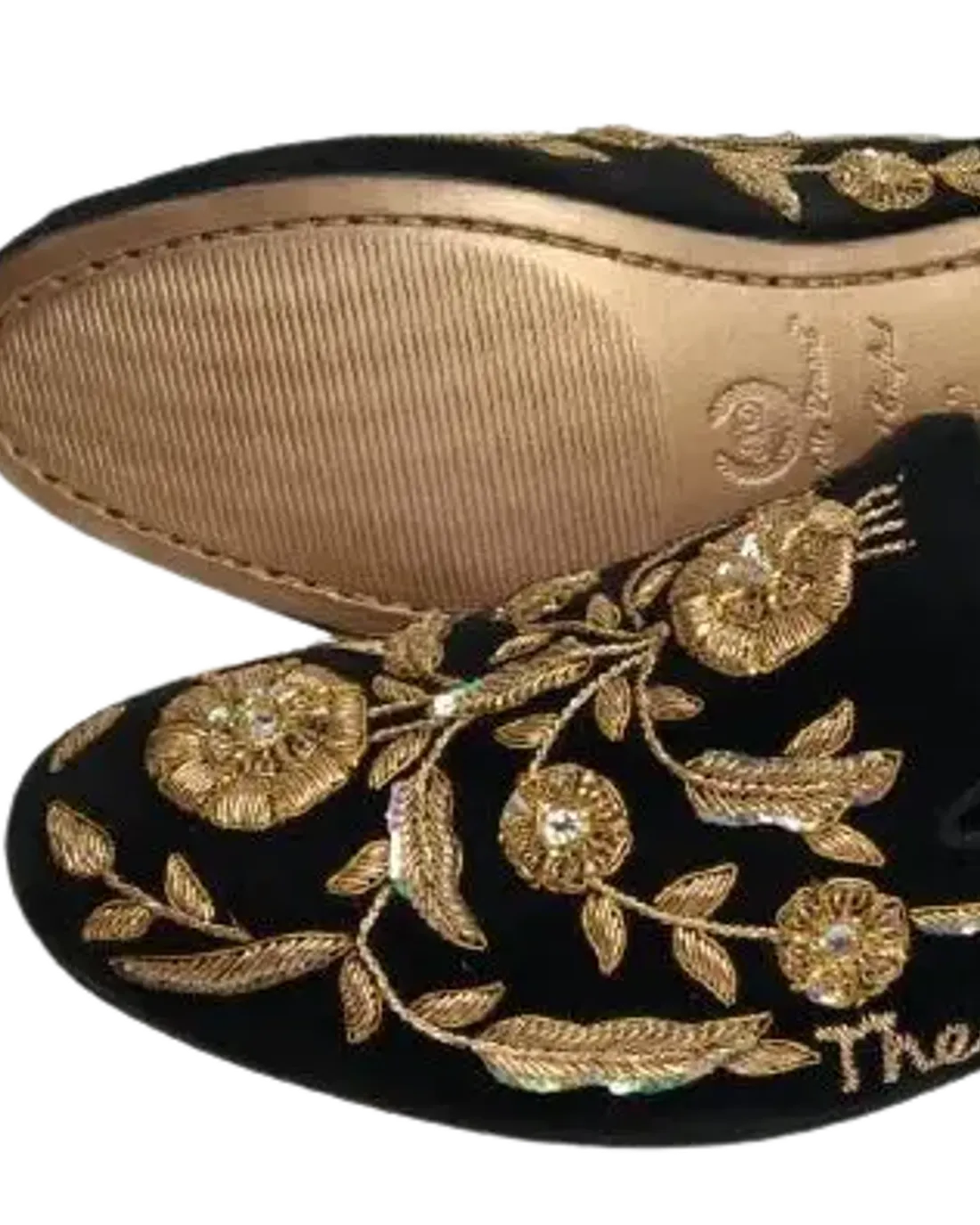 AARVIKA hand-embroidered gold juttis photographed in the studio